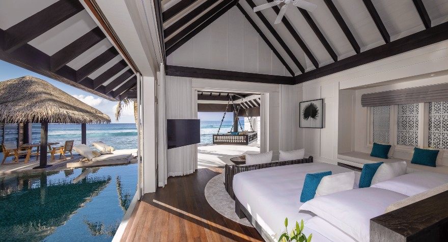 Guest bedroom of the Two Bedroom Ocean House with Pool at Naladhu Private Islands Maldives