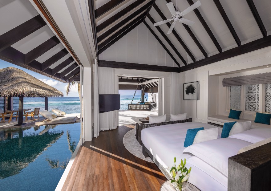 Guest bedroom of the Two Bedroom Ocean House with Pool at Naladhu Private Islands Maldives